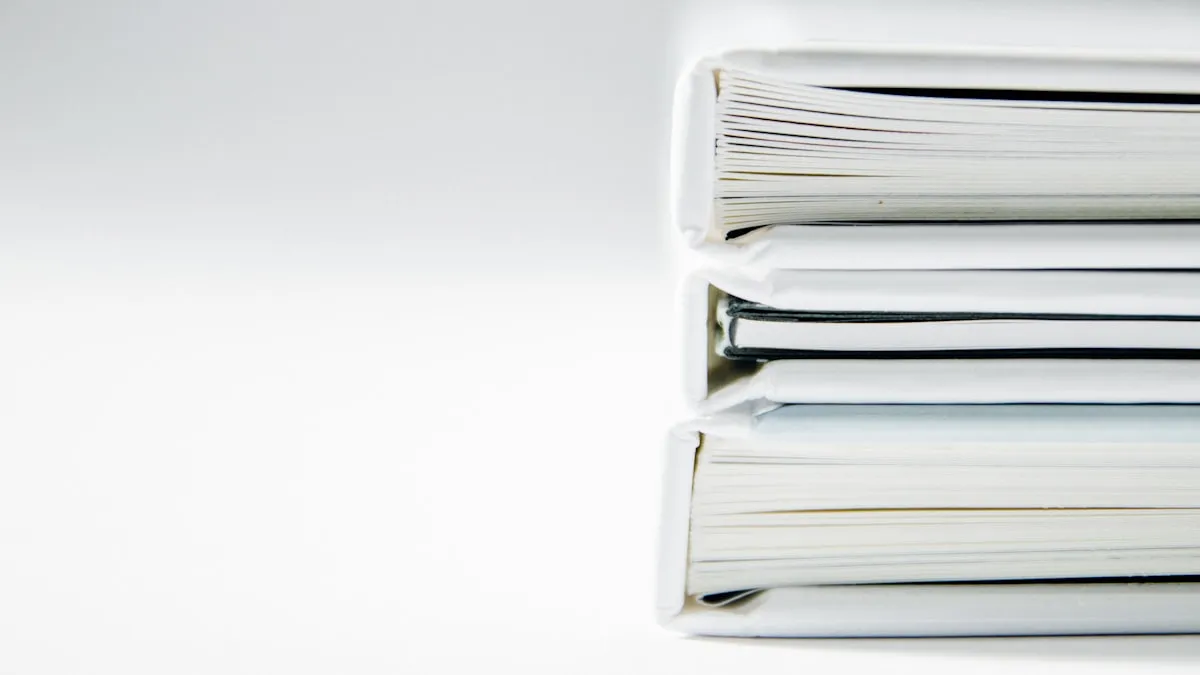A neat stack of document folders on a white background