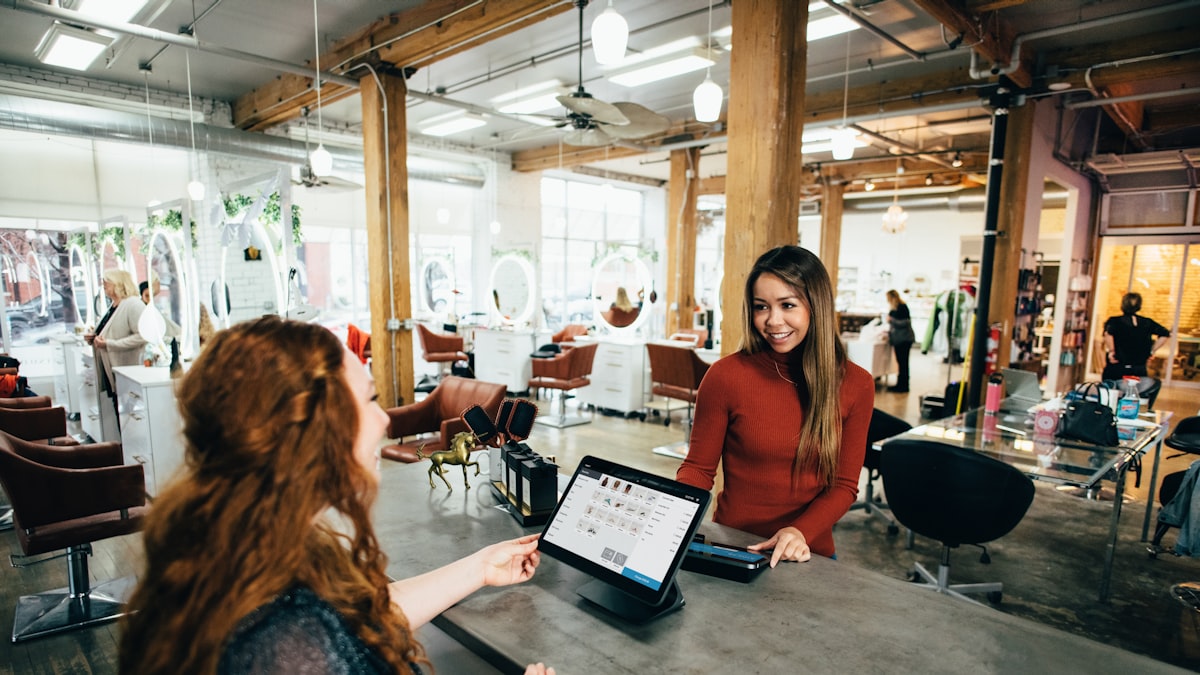Staff using a point-of-sale system at a retail counter